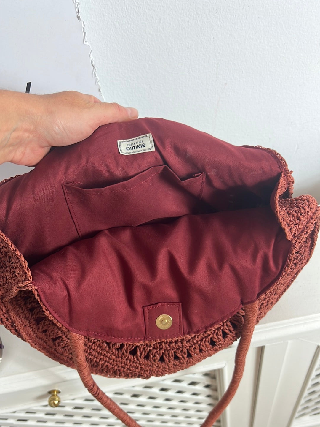 PIMKIE. Bolso rafia color teja redondo