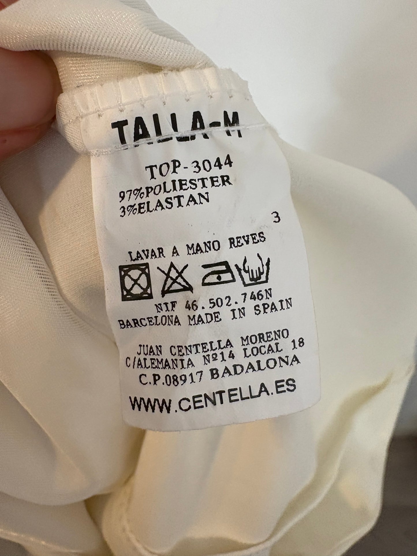 OTHERS. White asymmetrical top with puffed sleeves. TM