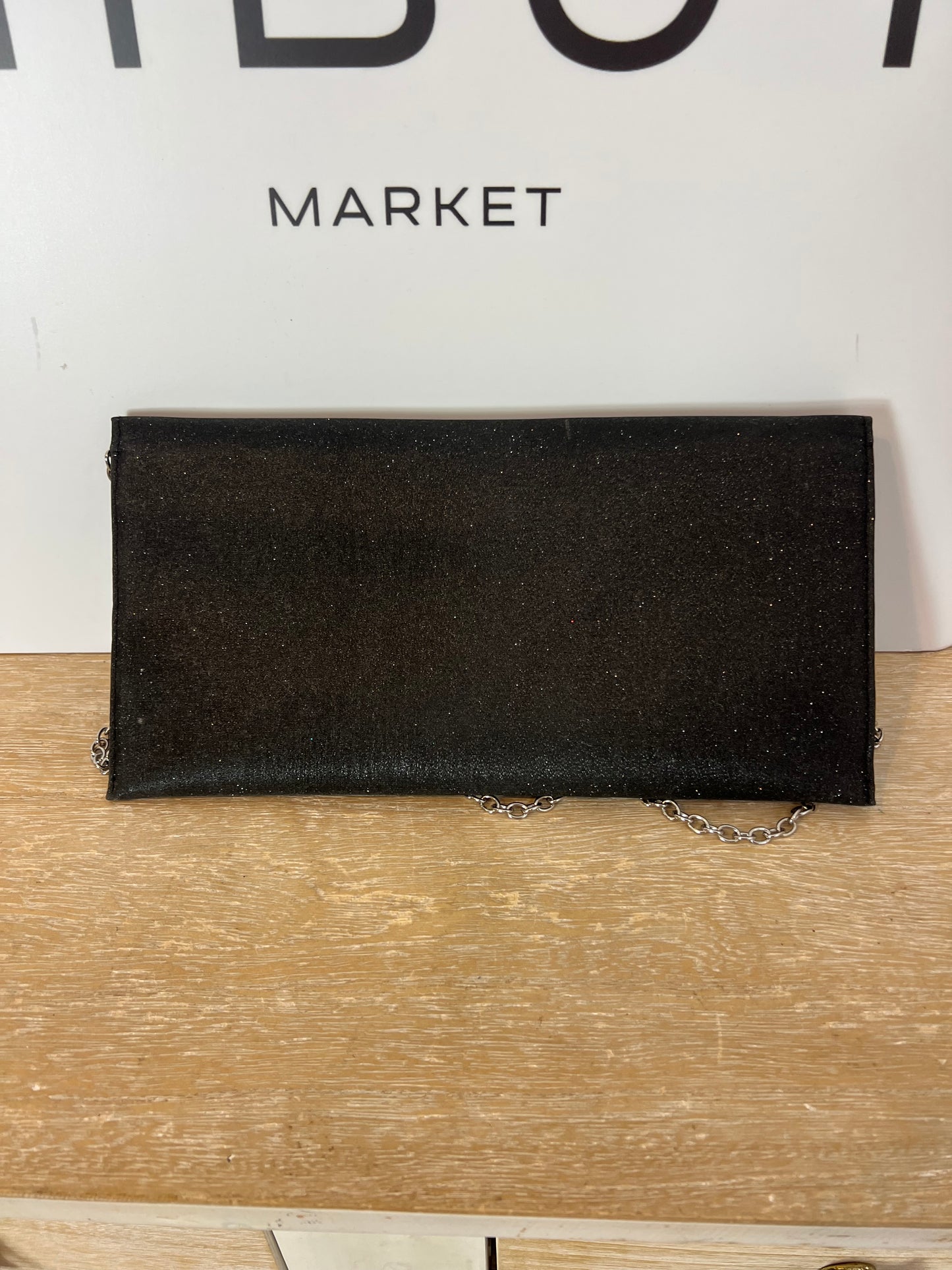 NEMBUR. Bolso de mano negro purpurina