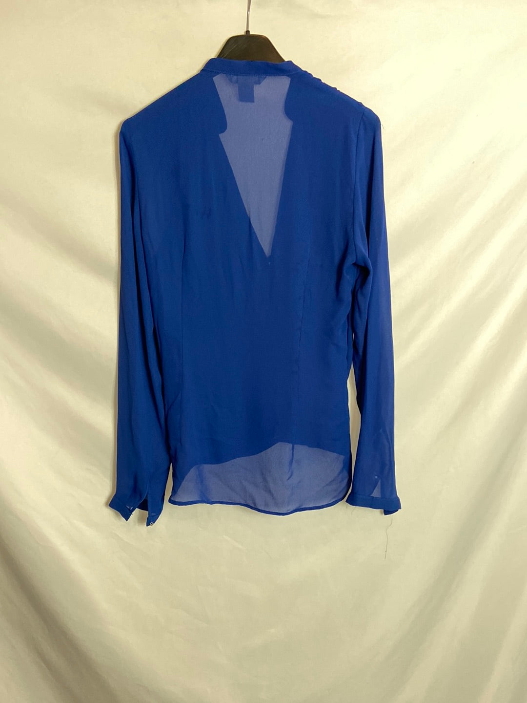 H&M. Blusa azul semitransparente T.34