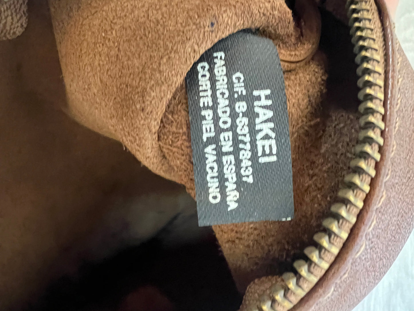 HAKEI. Cartera de mano piel