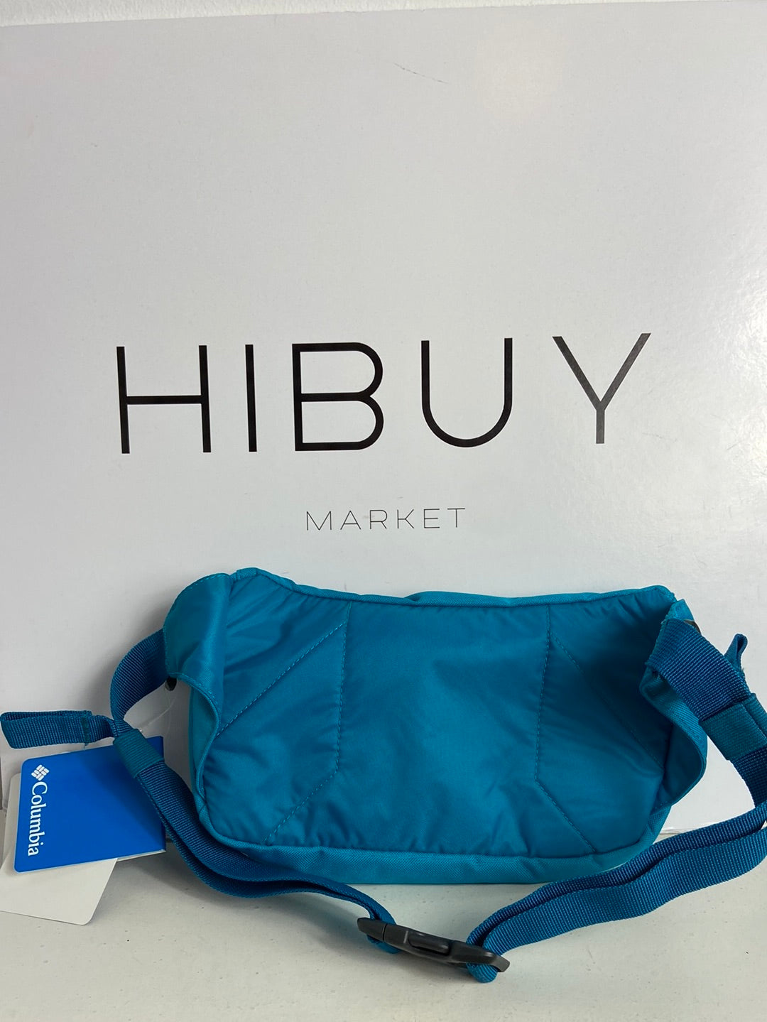 COLUMBIA. Riñonera azul logo T U