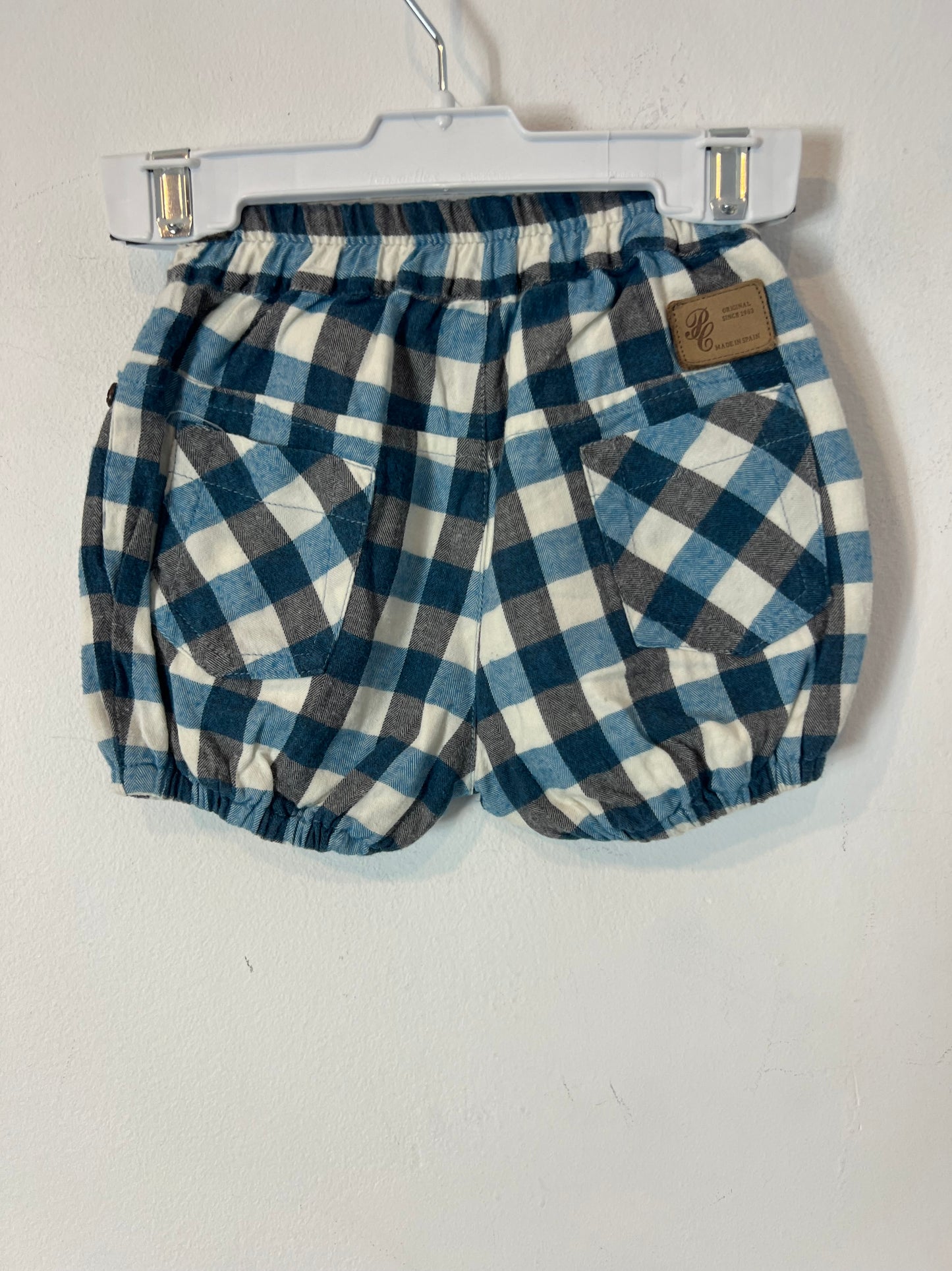 PILI CARRERA. Cubre pañal cuadros. T 12 meses