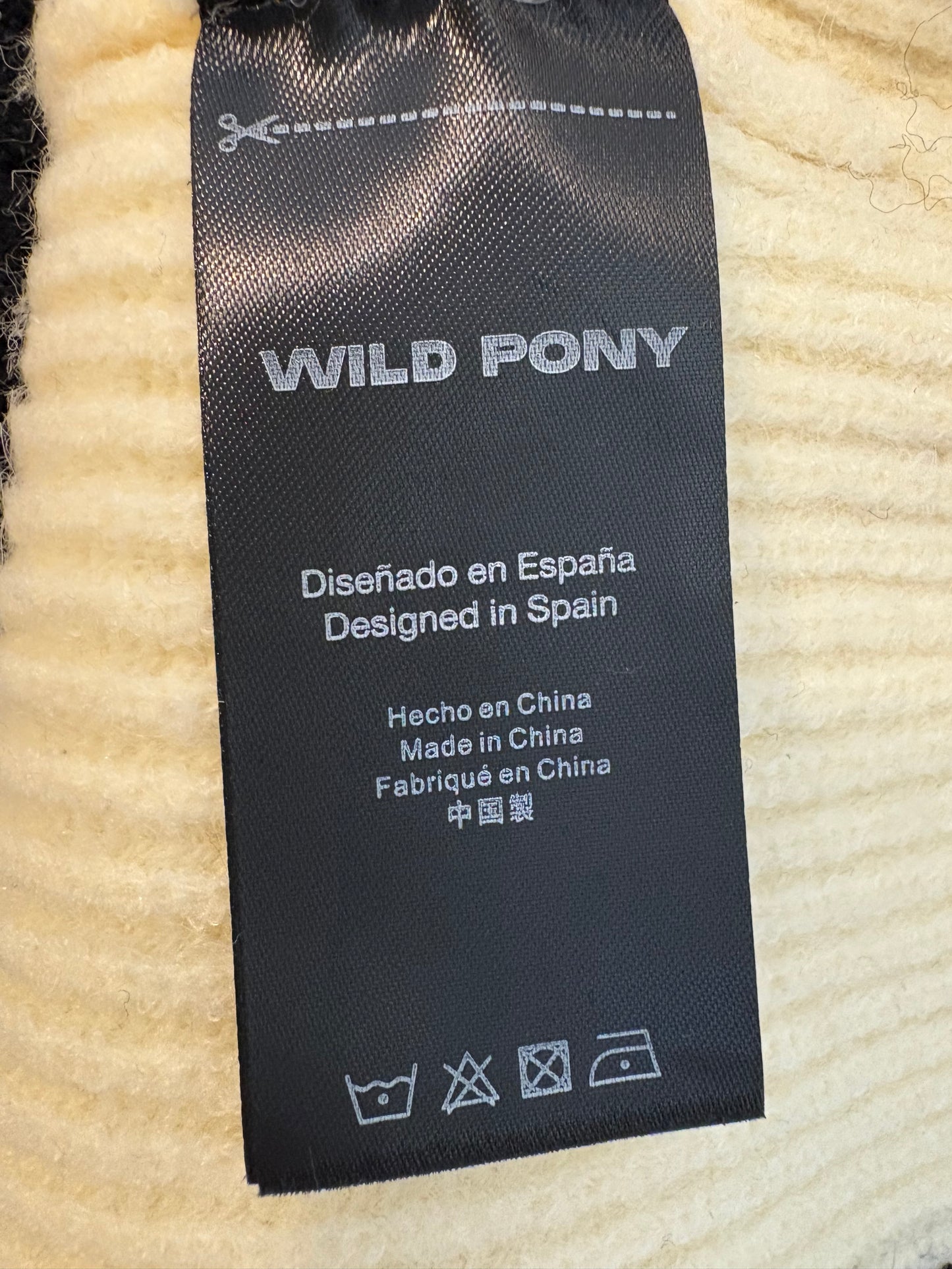 WILD PONY. Jersey bicolor cuello vuelto
