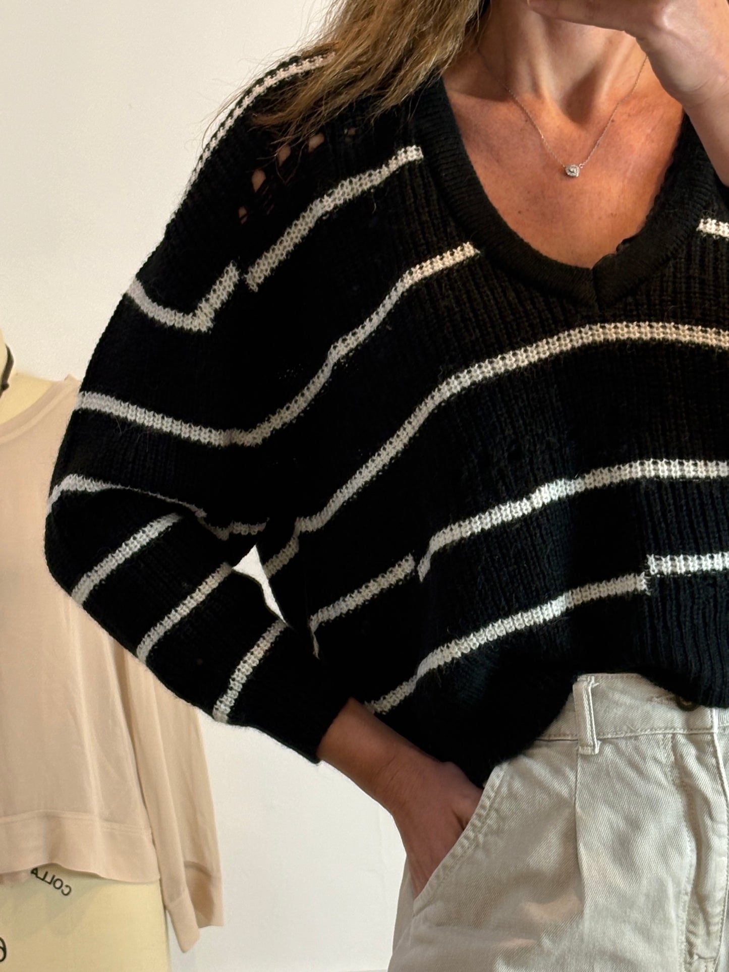 IRO. Jersey negro rayas