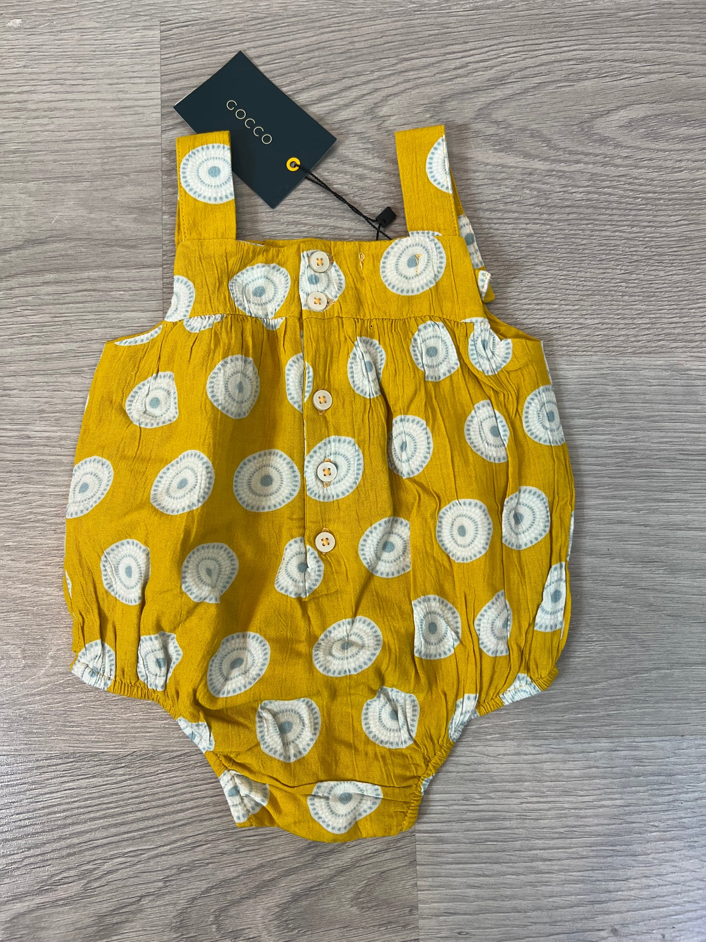 GOCCO. Ranita amarilla círculos T.6-9 meses