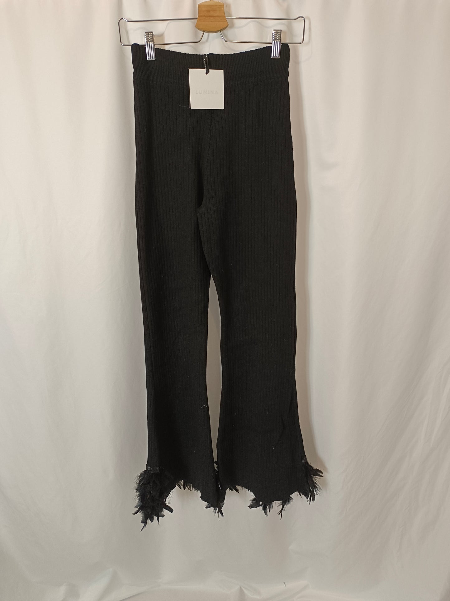 LUMINA. Black ribbed trousers with feathers Txs/s