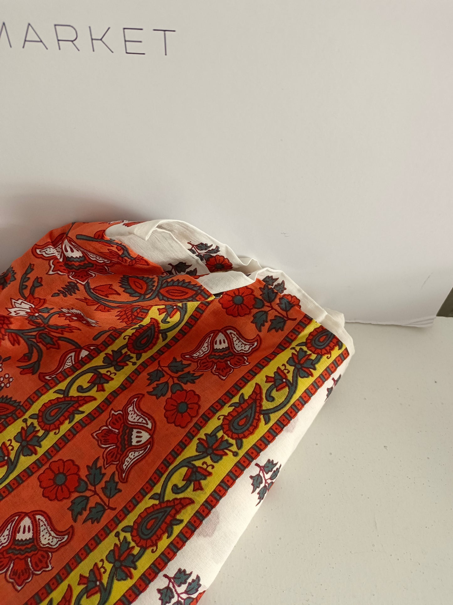 BOUGAINVILIA. White pareo with orange and yellow flowers