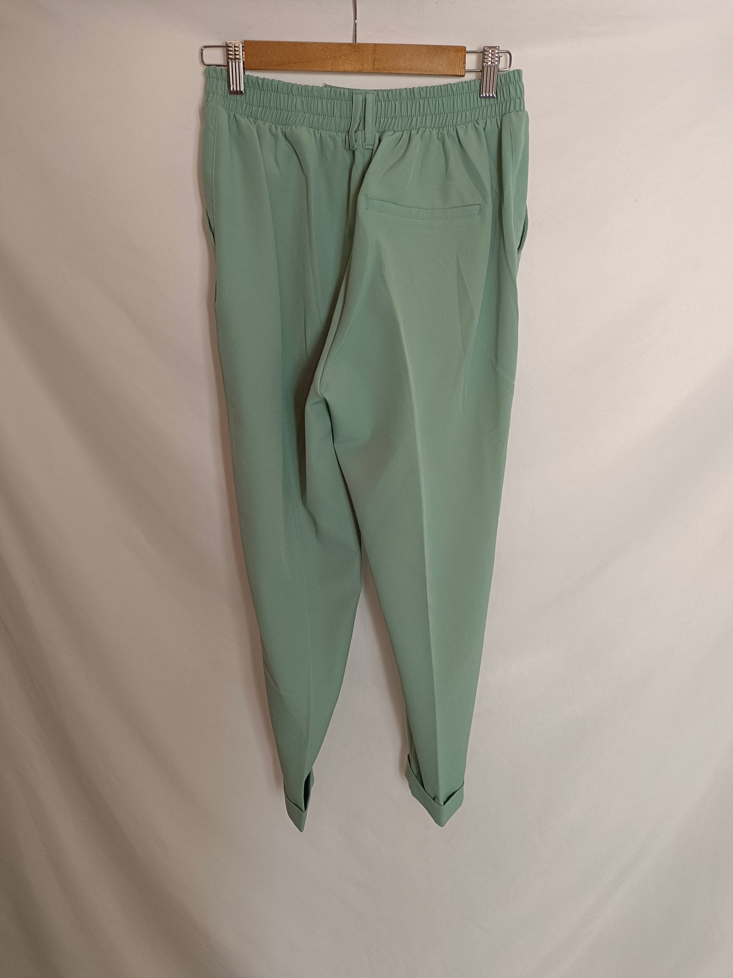BERSHKA. Aqua green flowing trousers. TM