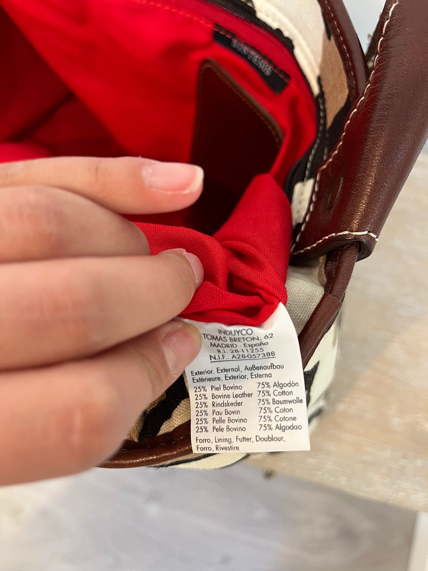 SYNTHESIS. Animal print bag with leather