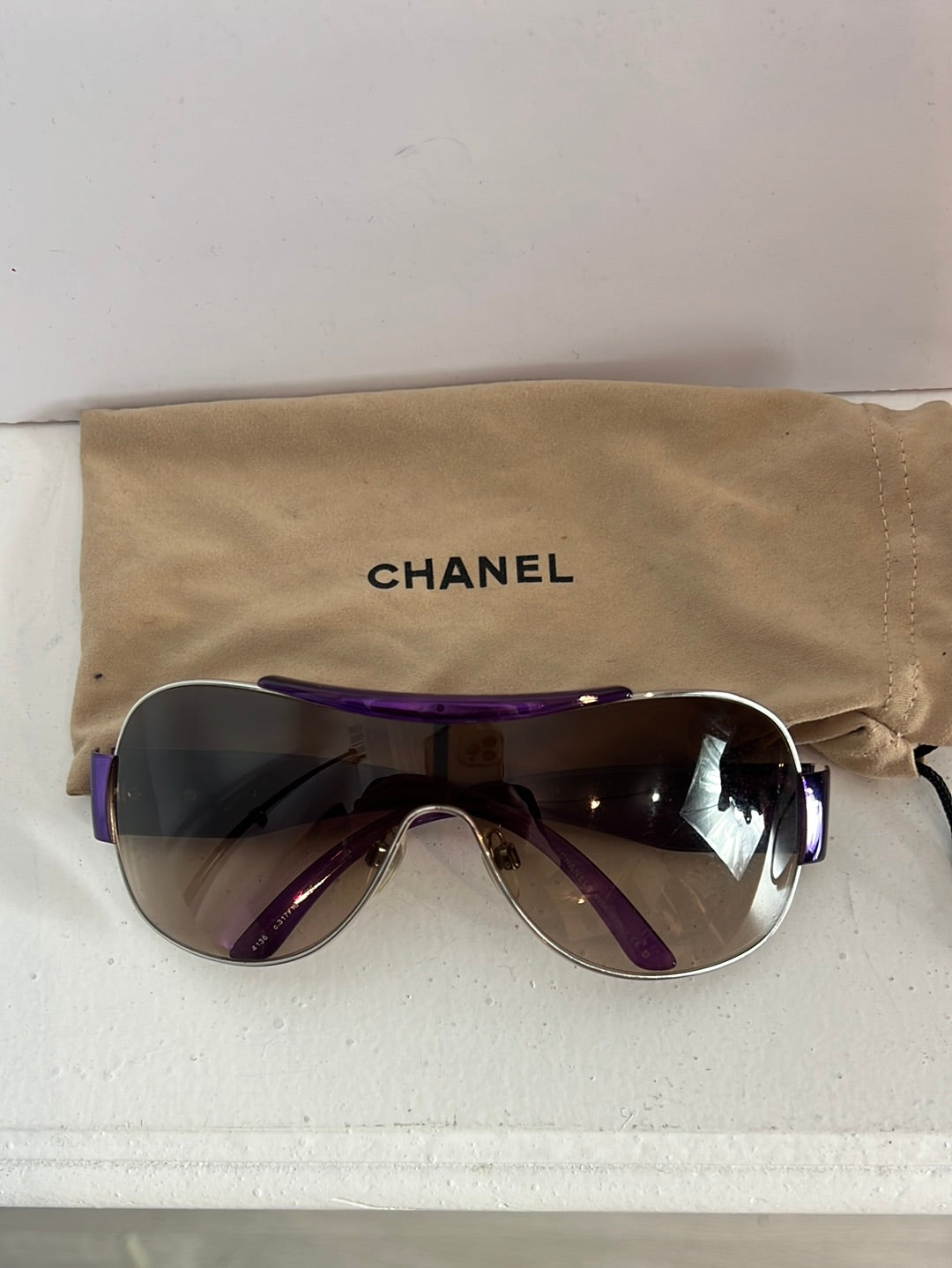 CHANEL. Purple-rimmed glasses