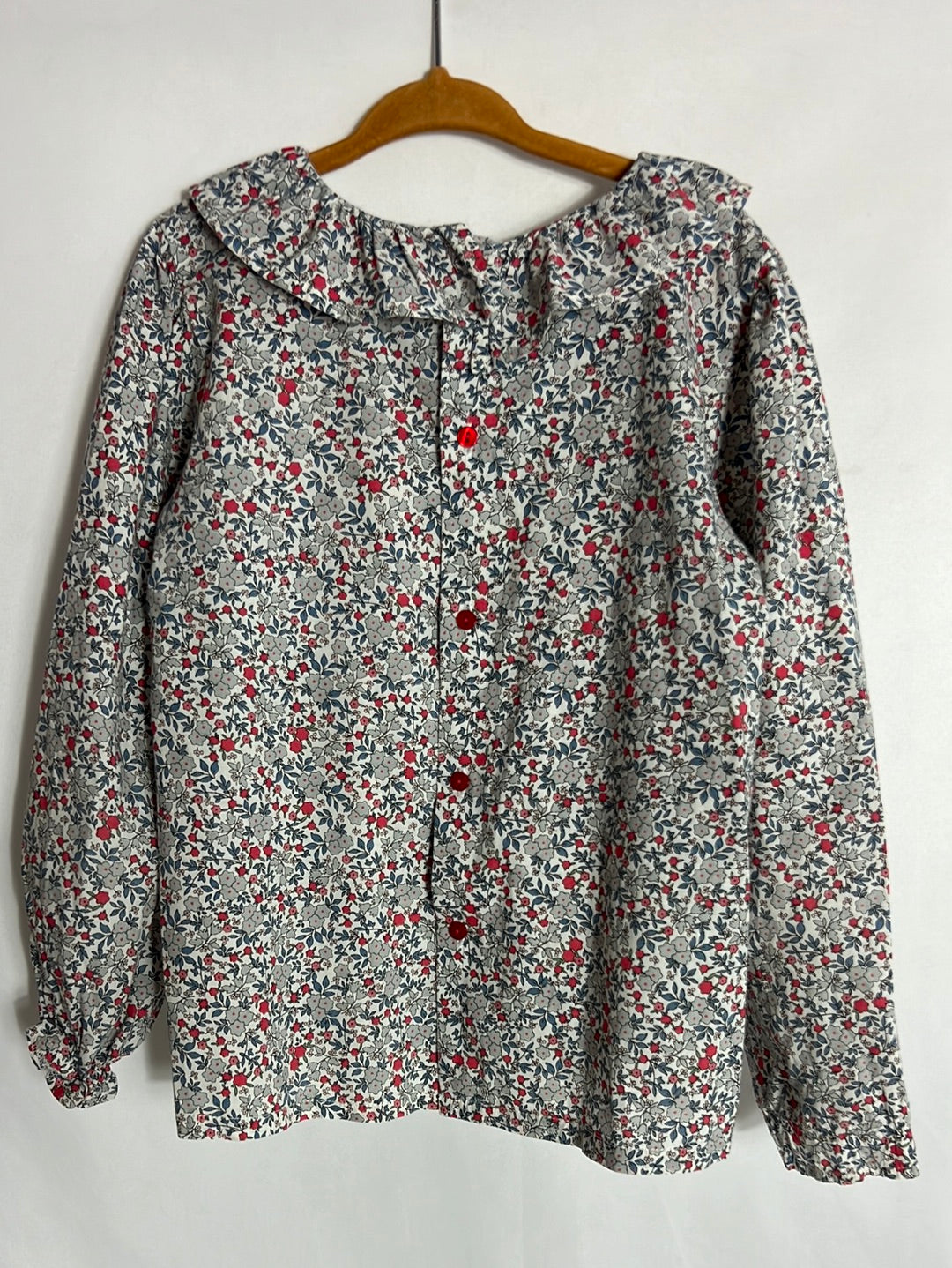 OTRAS. Blusa flores mini azules y rojas. T 6 años