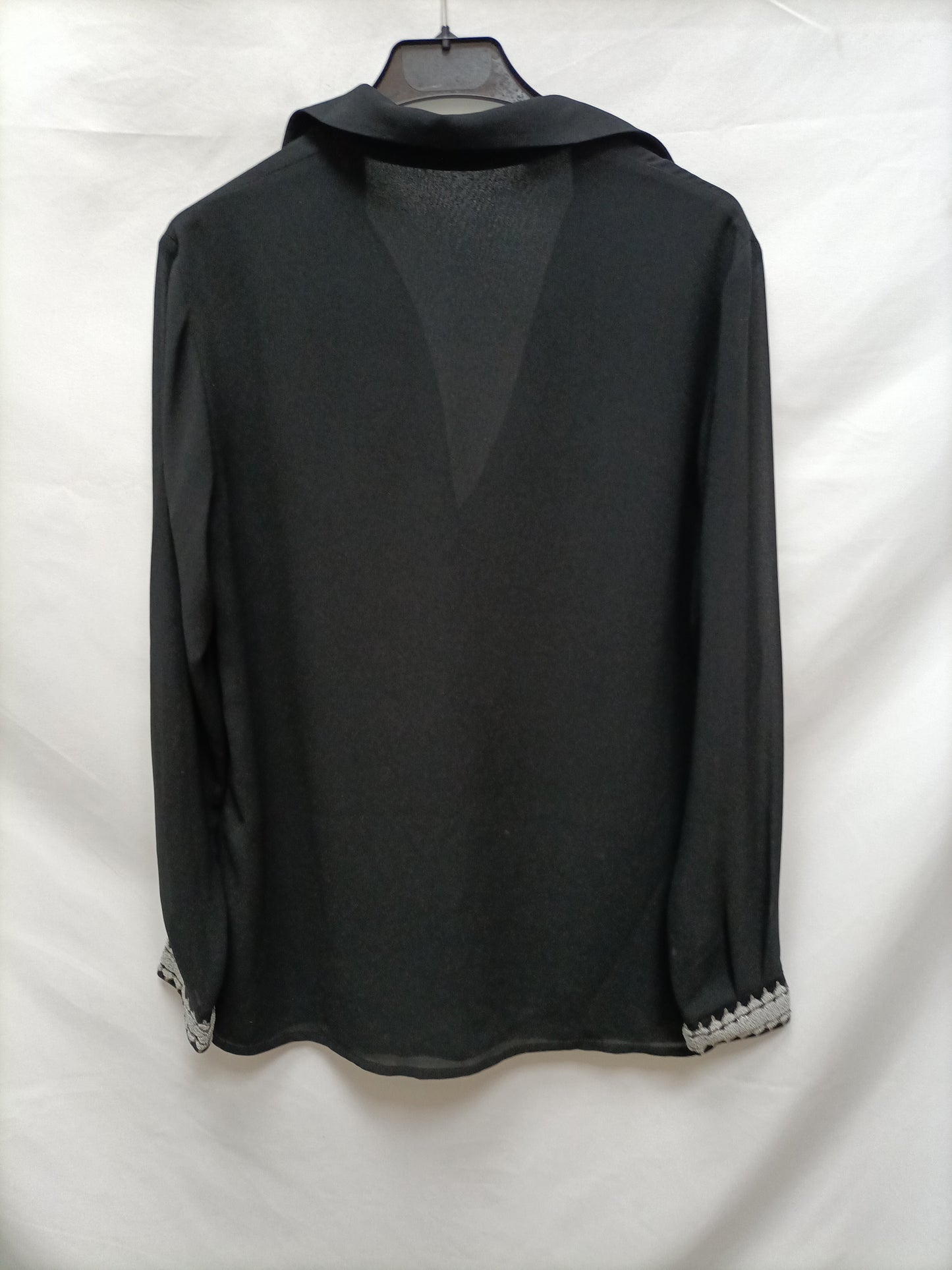 BIMANI. Black blouse with cuffs