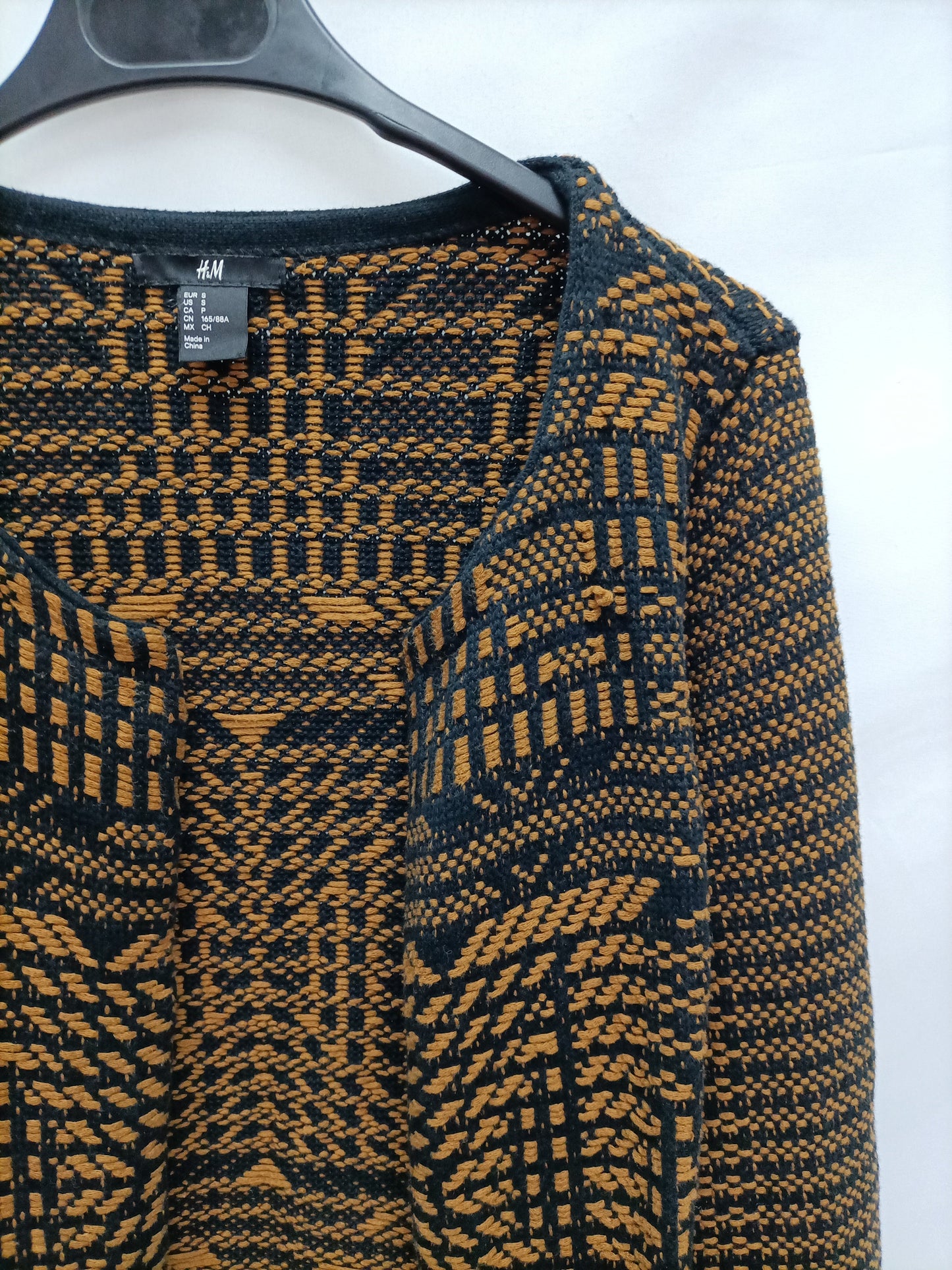 H&M. Cargidan étnico negro y ocre T.s