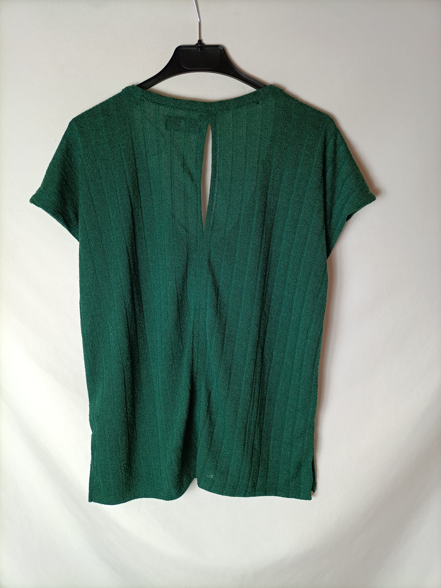 LEFTIES. Green ribbed top. T.S.