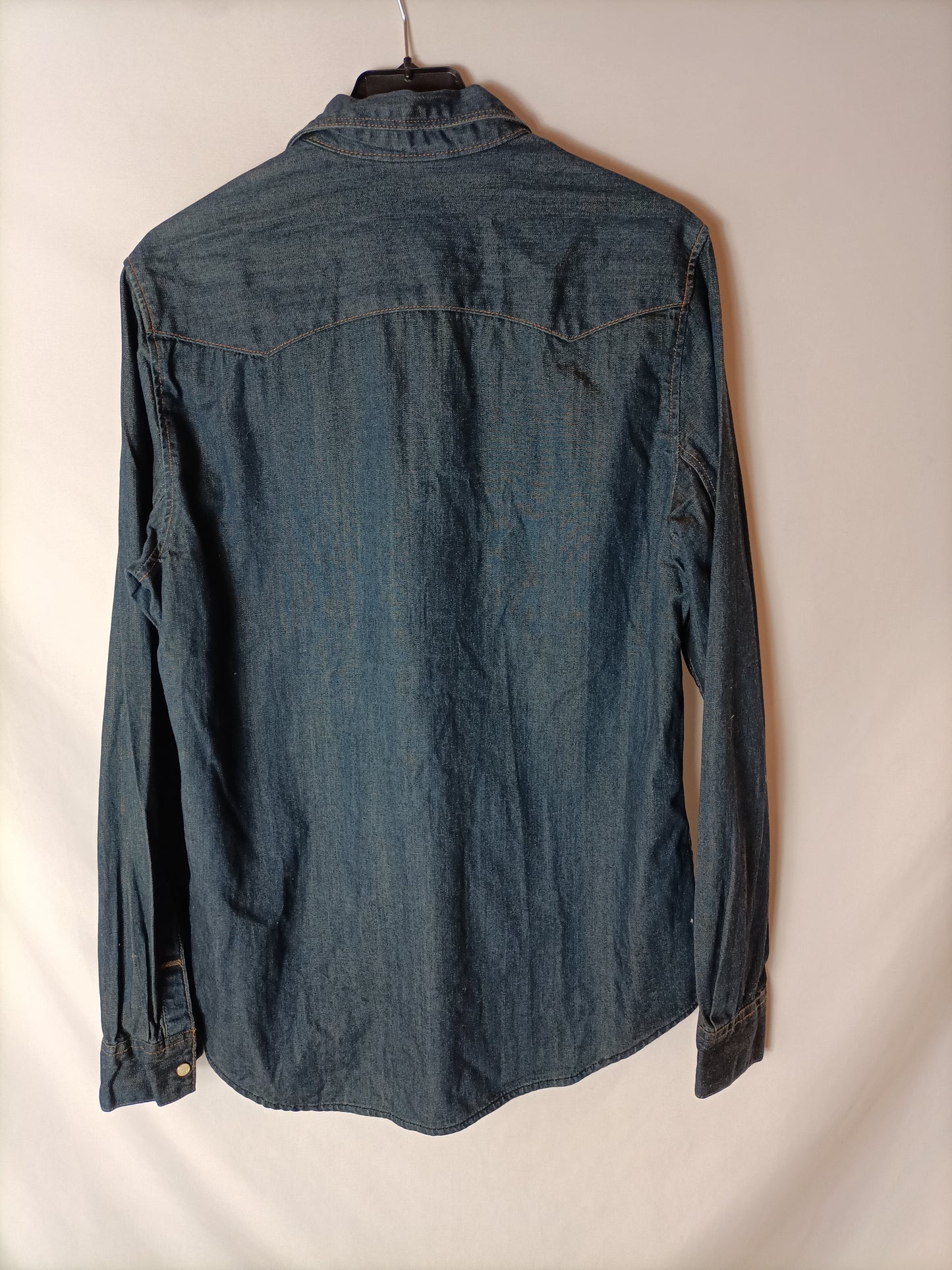 H&M. Over a dark denim shirt. TS
