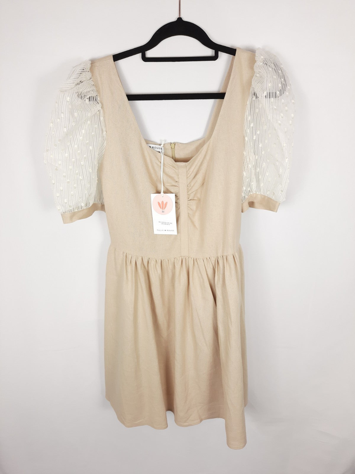 Red Tulle. Beige dress with transparent sleeves.