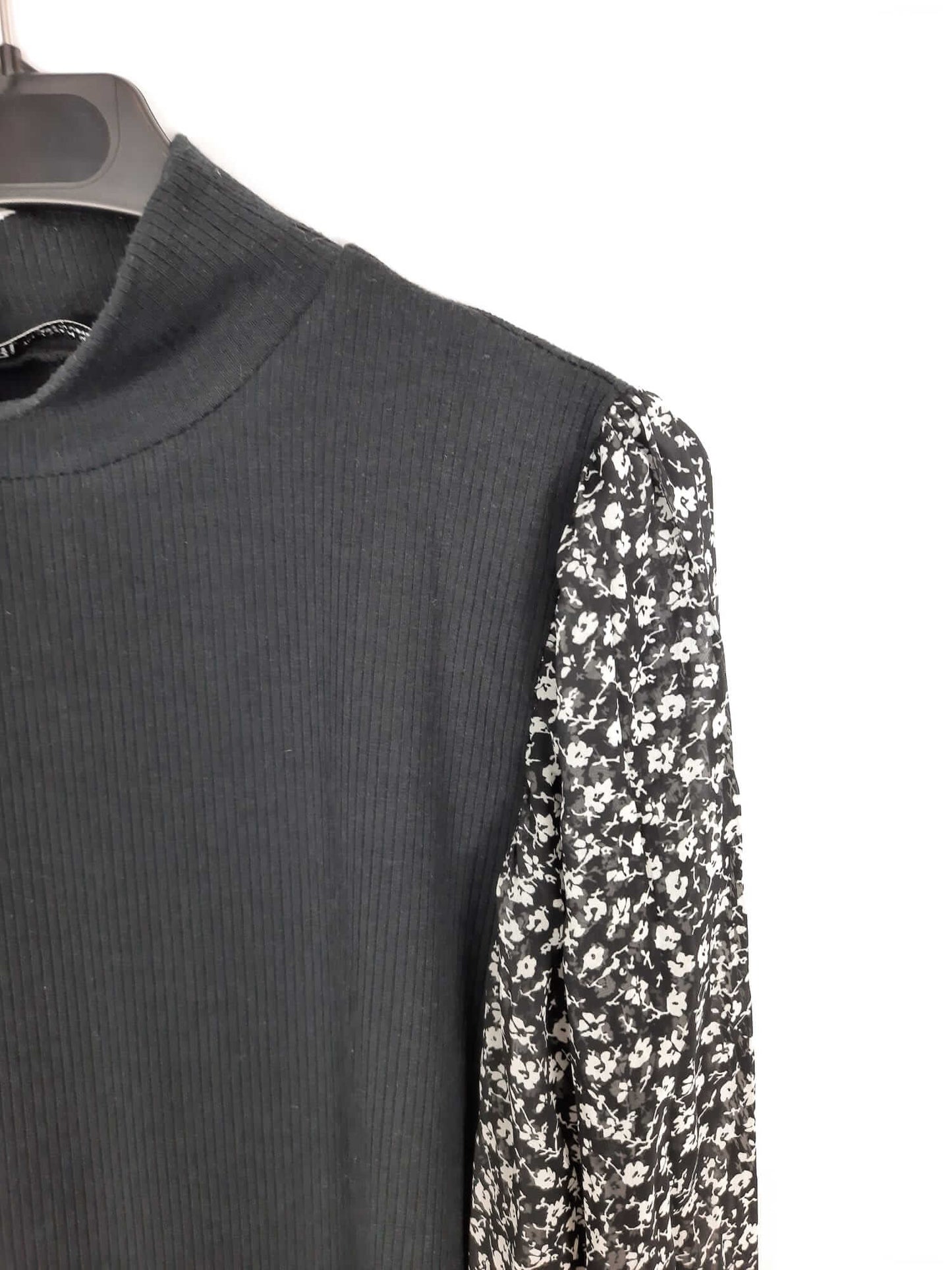 ZARA. Black double-textured sweater/top with floral print sleeves. Size m