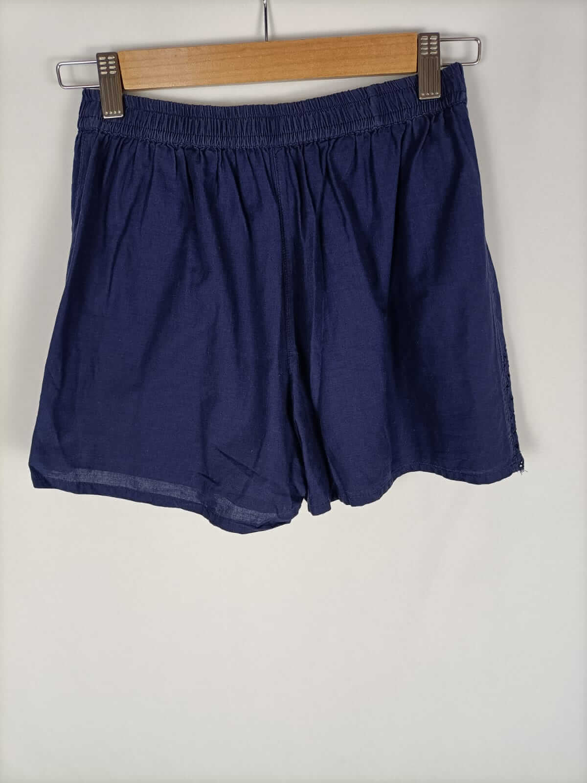 PRIMARK.Pantalón azul troquelado y bordado T.38