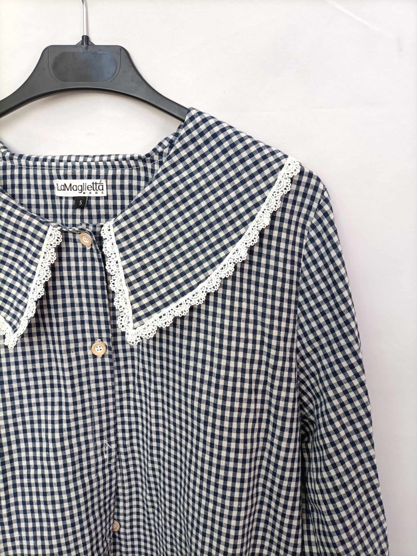 THE T-SHIRT. Gingham check blouse with a baby collar.