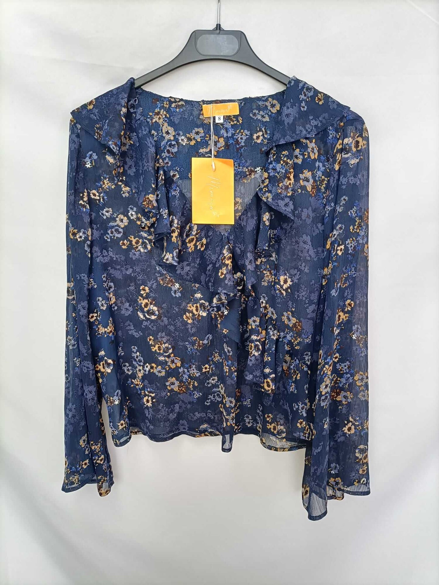 MIMOSA. Blue blouse with flowers and ruffles Ts