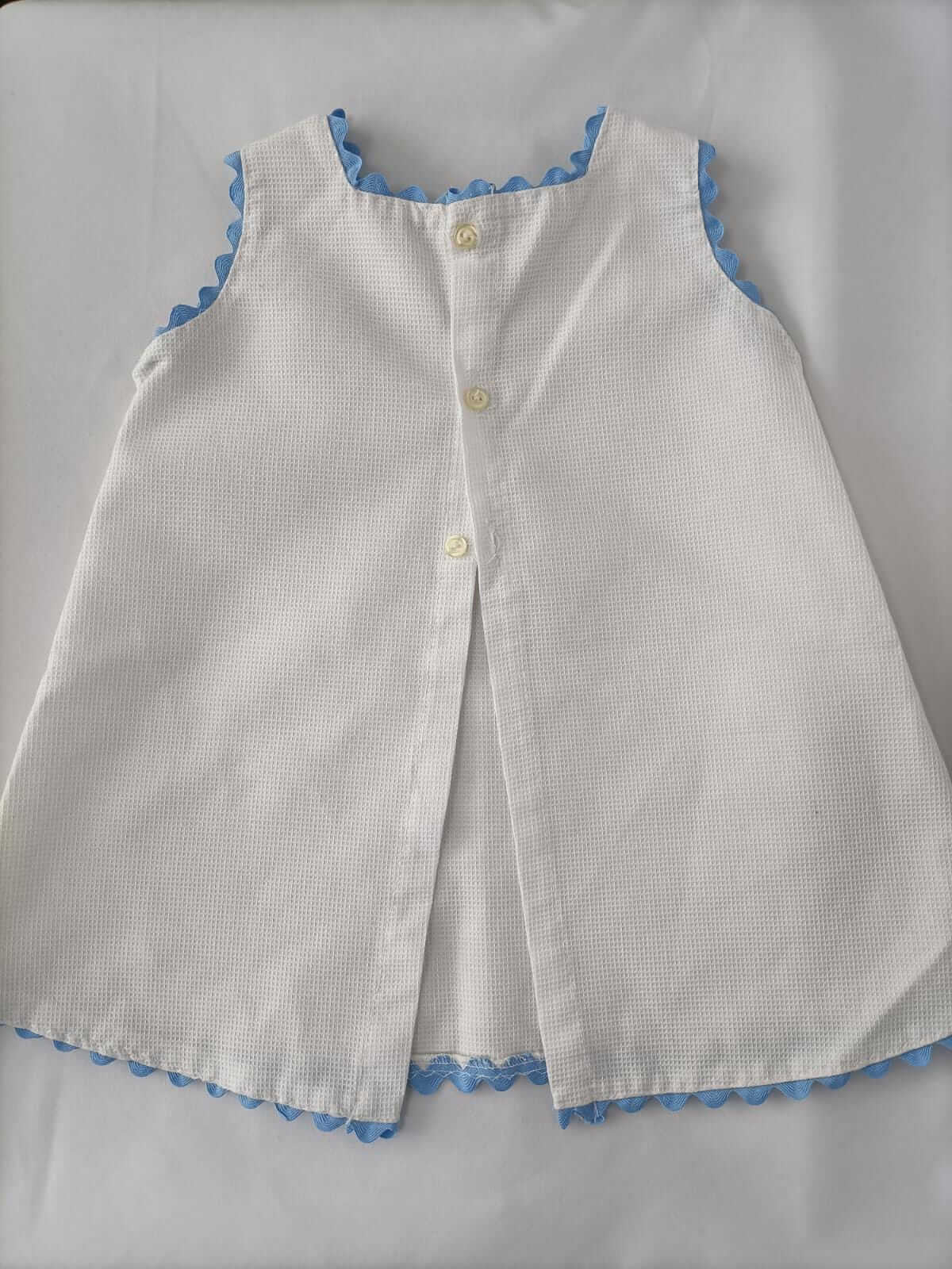 OTRAS.Faldón blanco piqué T.9-12 meses
