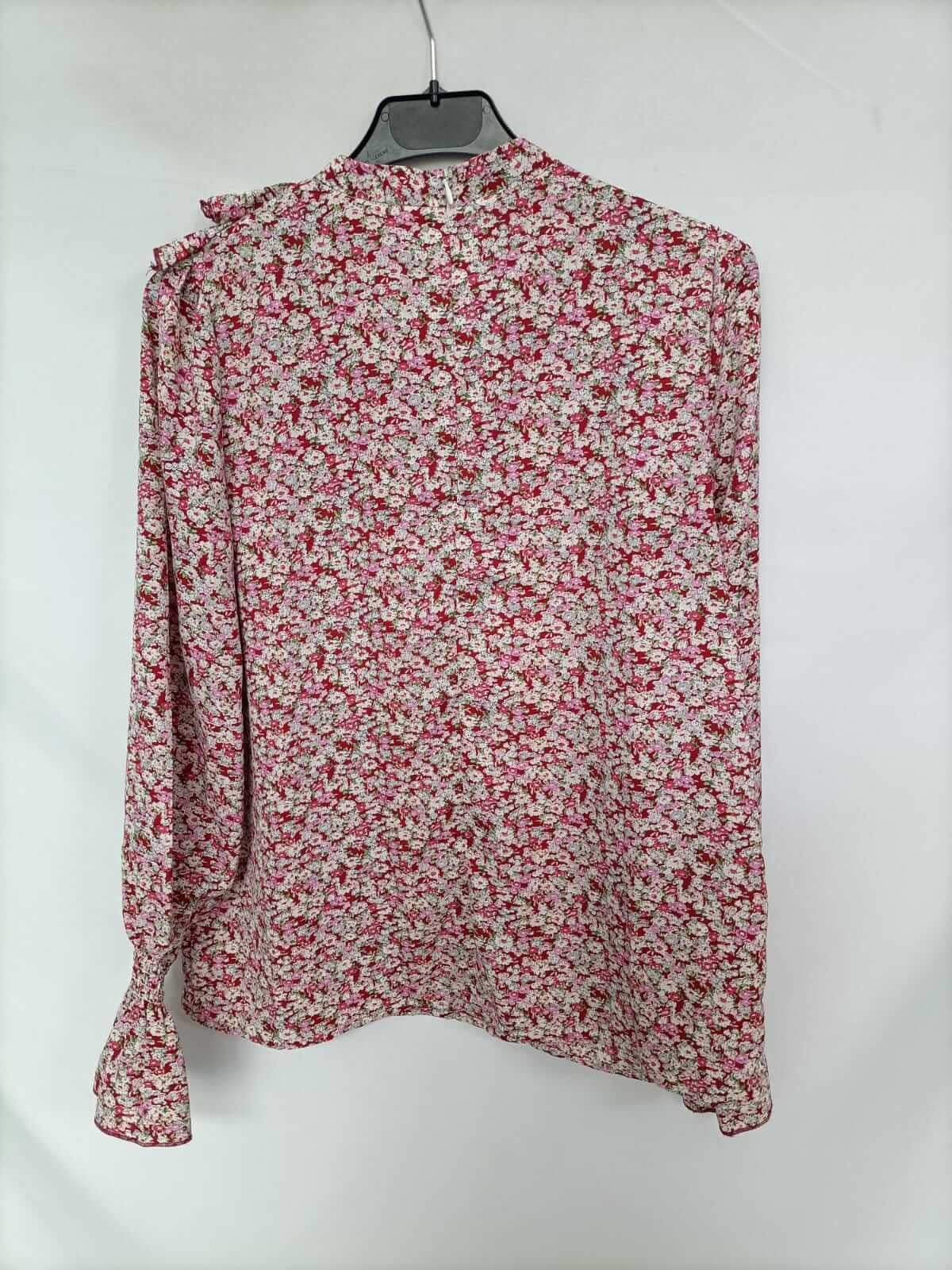 OTRAS. Blusa flores y volantes T.s