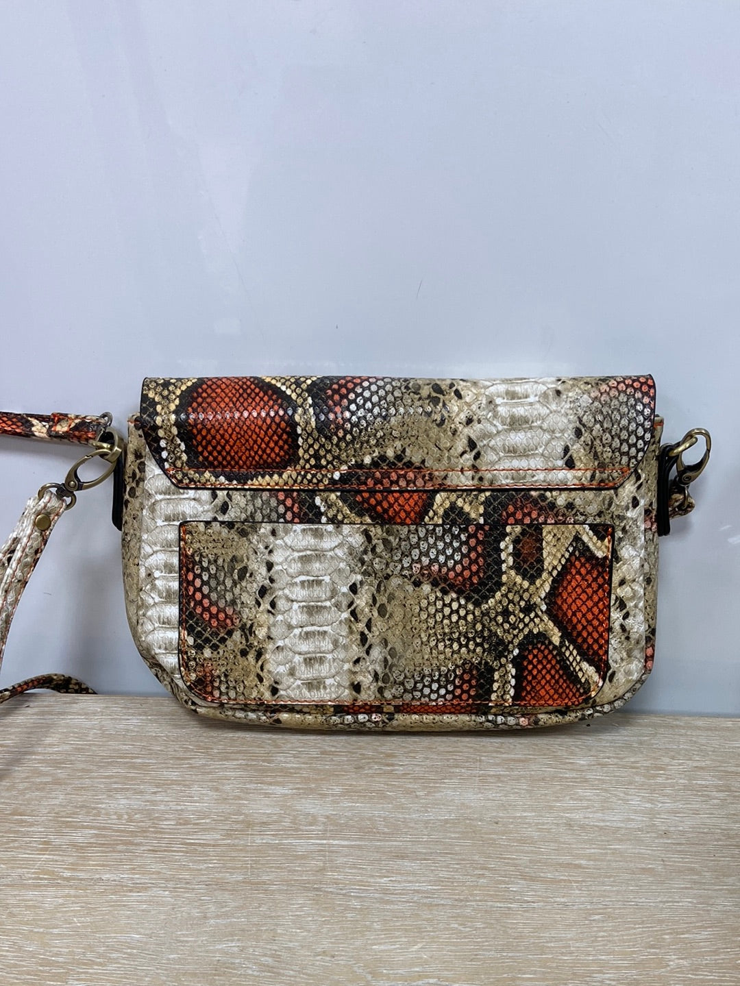 MISAKO. Beige and orange animal print bag