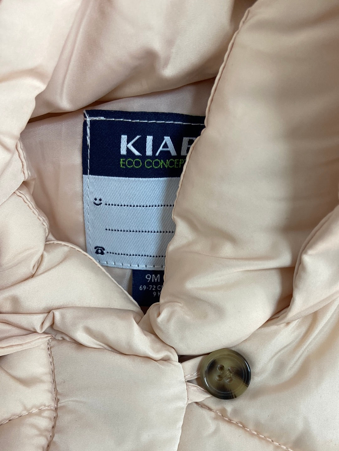 KIABI.Plumas beige rosita 9 meses