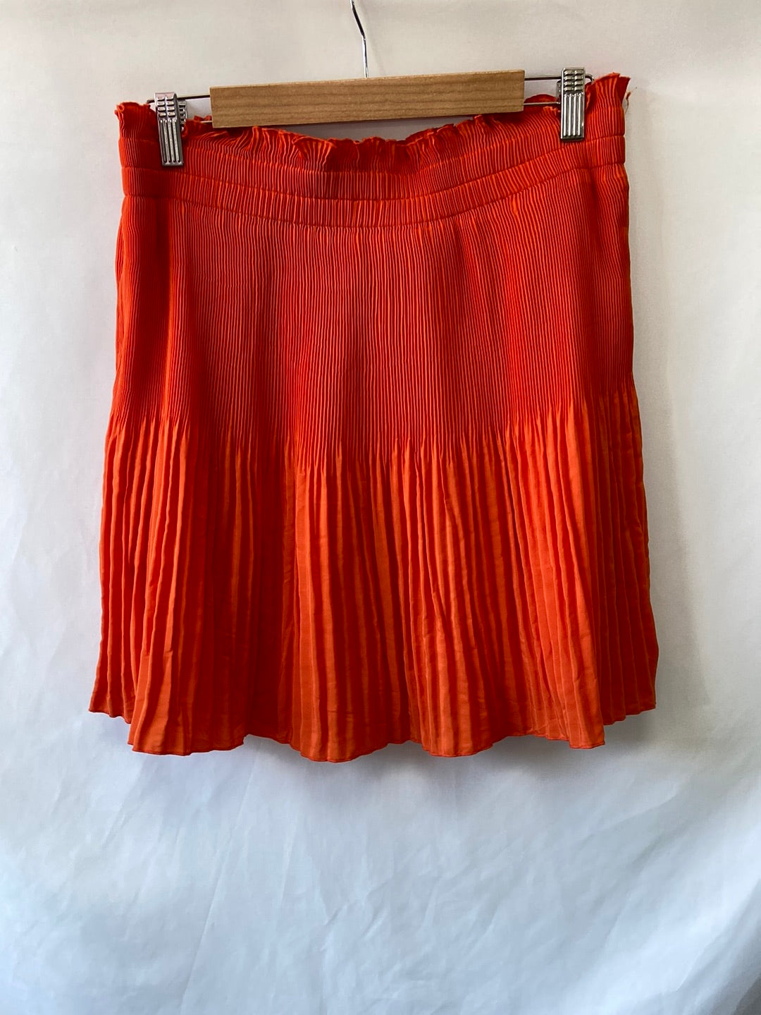 H&M. Orange pleated skirt size 46