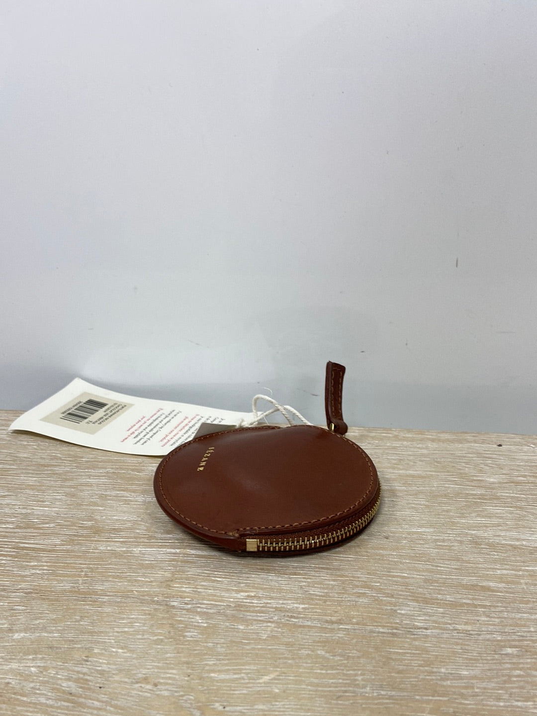 SEZANE. Monedero mini camel de piel