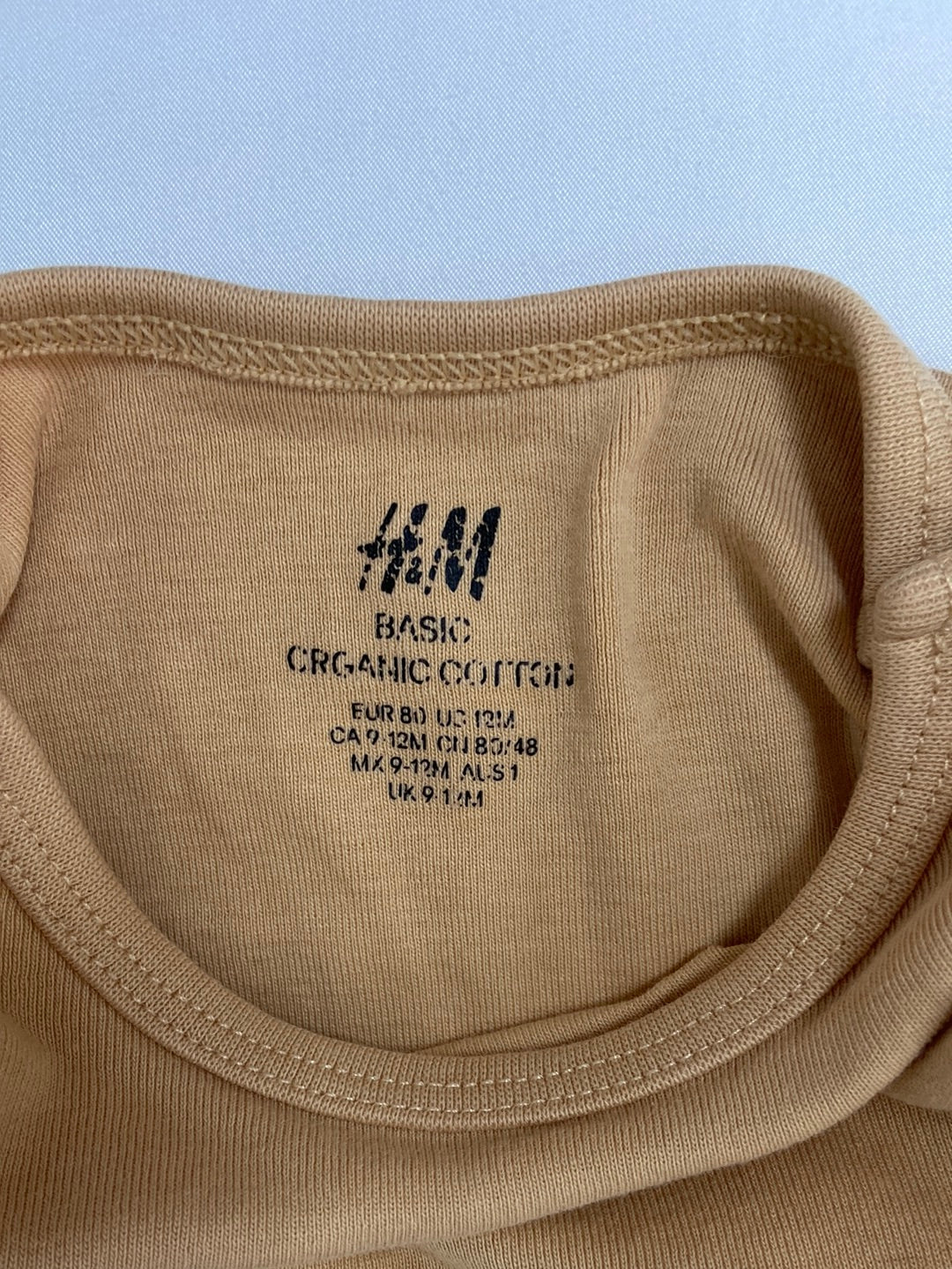 H&M.Body pastel mustard 9-12 months
