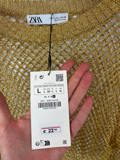 ZARA. Top rejilla dorado.T L