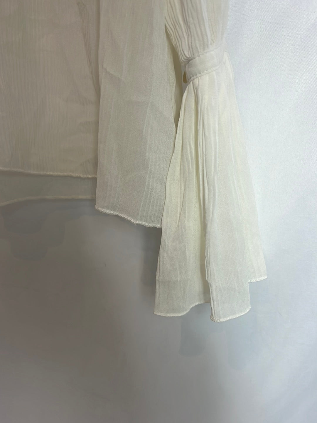 OTRAS. Blusa fluida plisada. T M