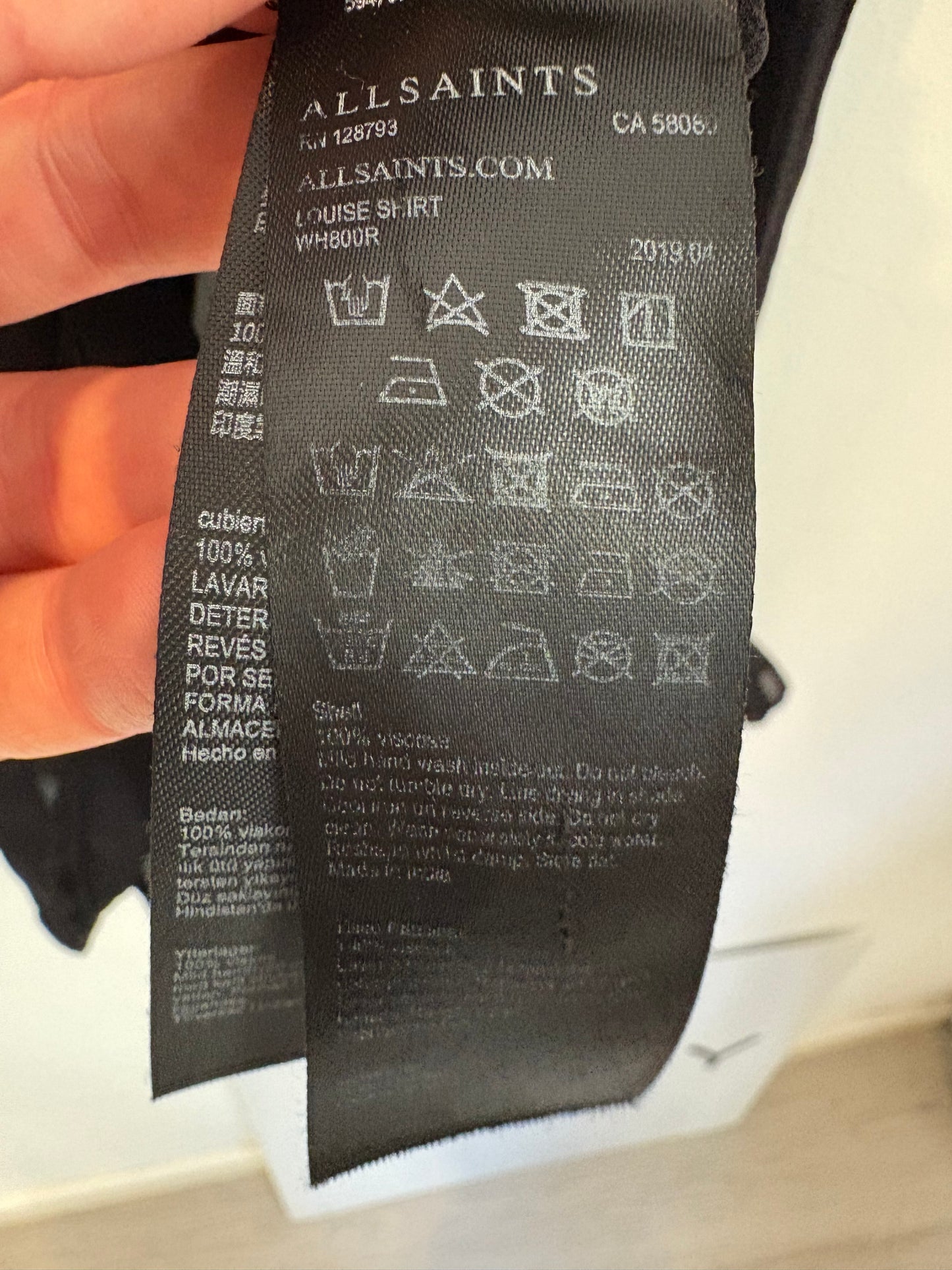 ALL SAINTS. Blusa negra semi transparente