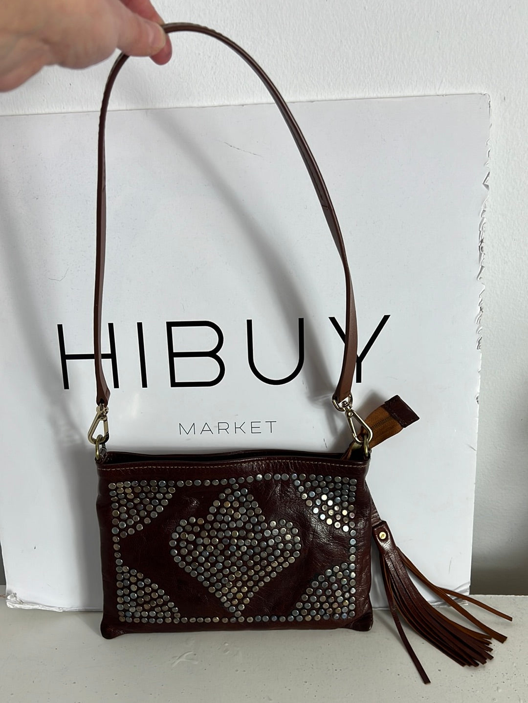 OTHERS. Brown leather bag with studs