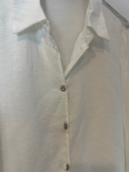 TINTORETTO. Blusa blanca botones joya