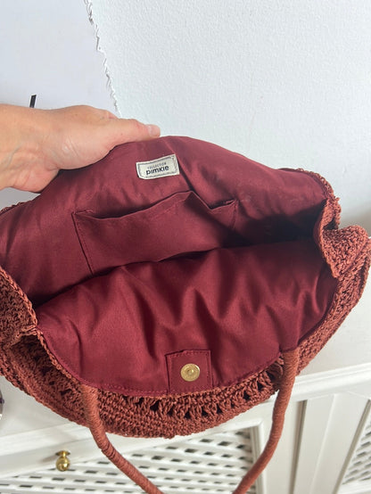 PIMKIE. Bolso rafia color teja redondo