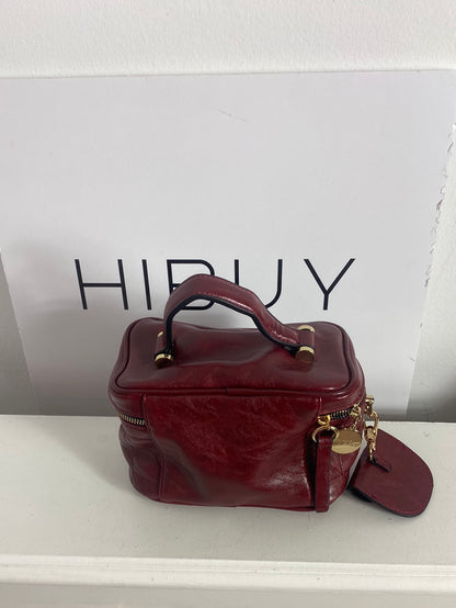MIMI MUA. Burgundy bag