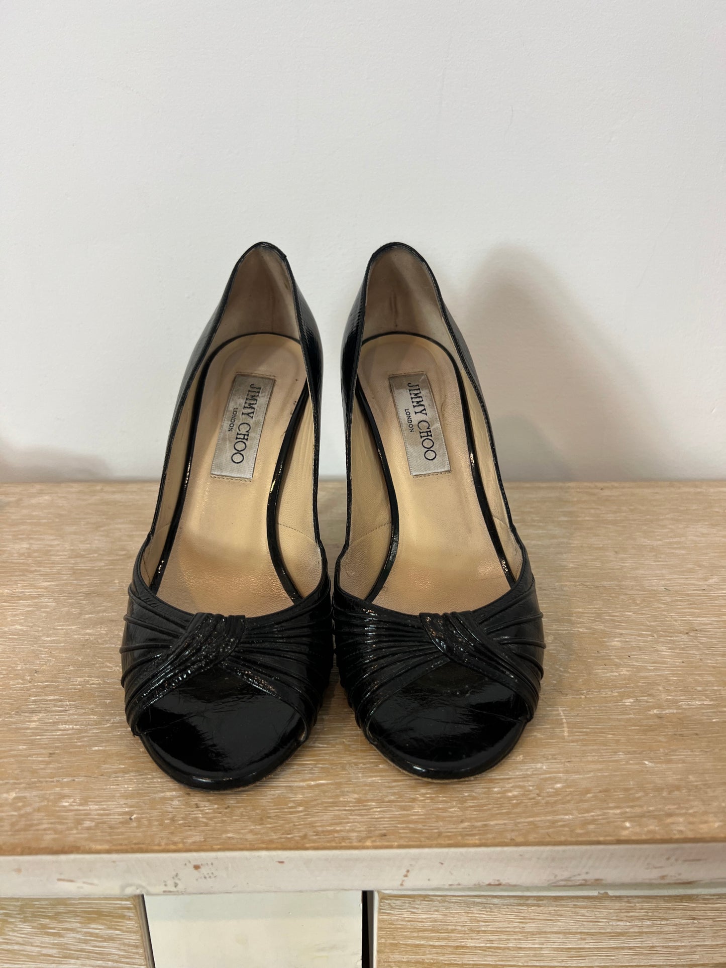 JIMMY CHOO. Black patent leather peeptoe heels. Size 37.5 (tare)