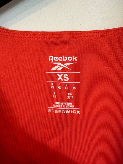 REEBOK. Top deportivo rojo. T XS