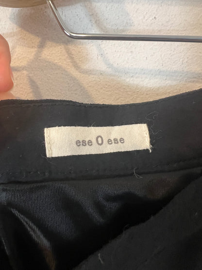 THAT OR THAT. Flowing black buttoned skirt. TL