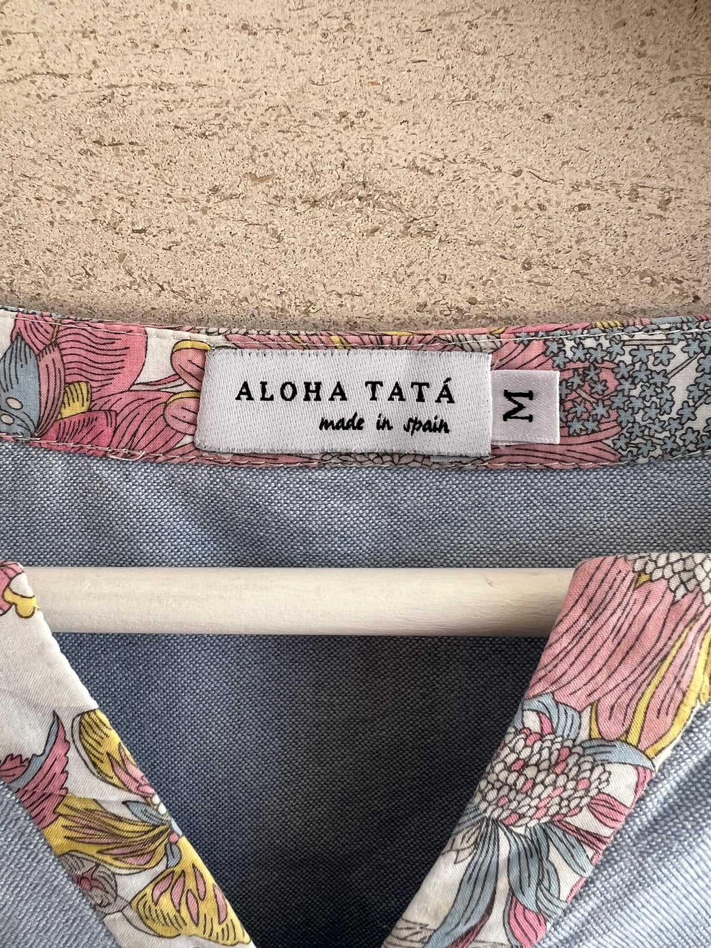 ALOHA TATA. Light denim blouse with flower detail. TM