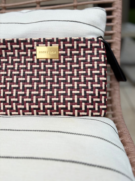 BIMBA Y LOLA. Cartera de mano trenzada