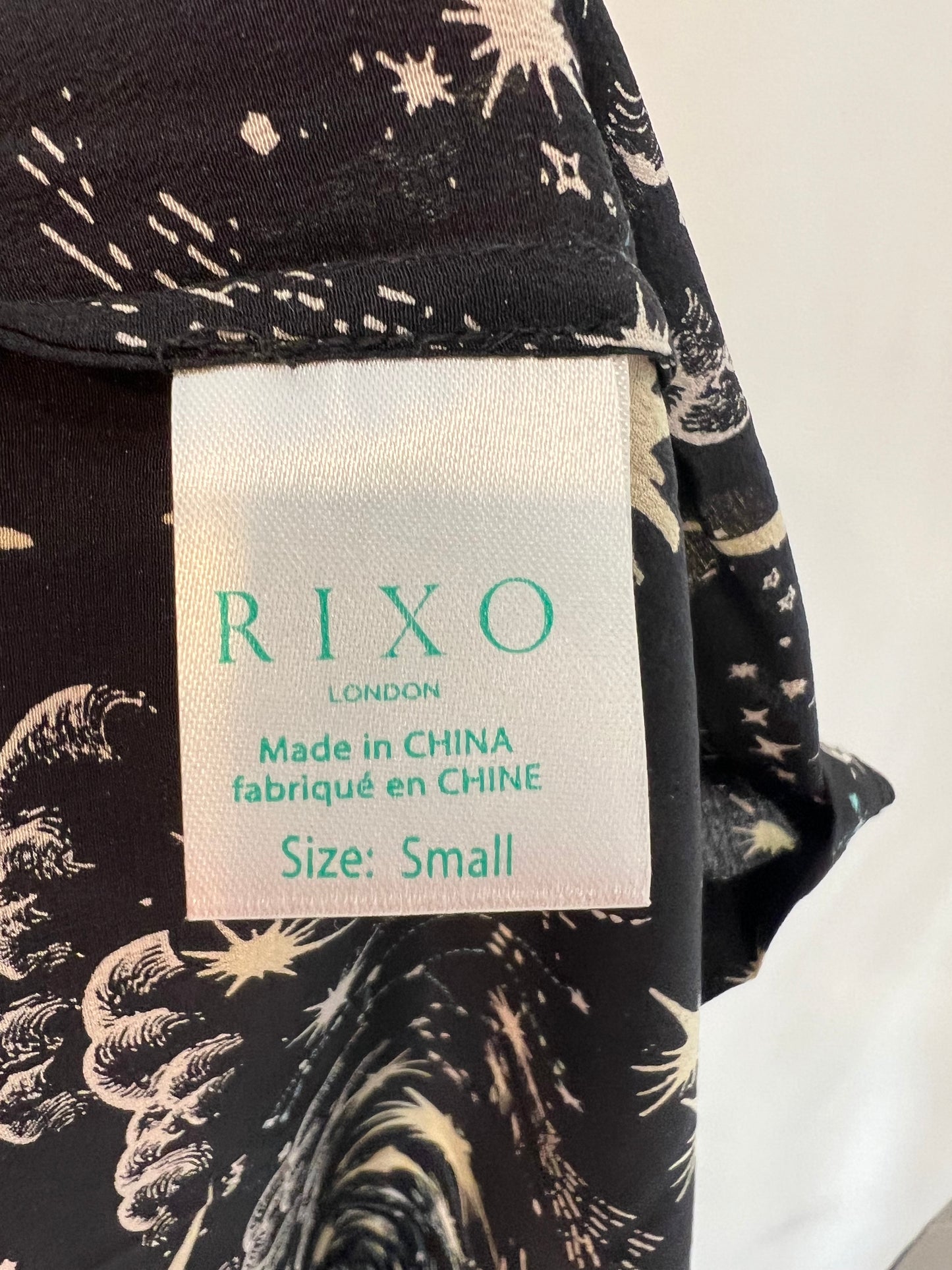 RIXO LONDON. Falda midi seda negra estampada T.s