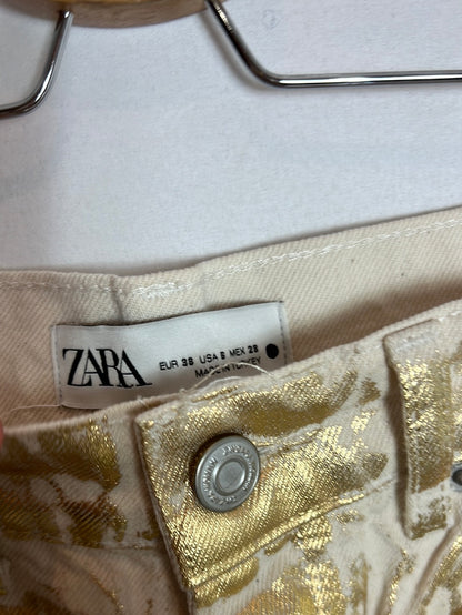 ZARA. Gold distressed denim trousers. Size 38