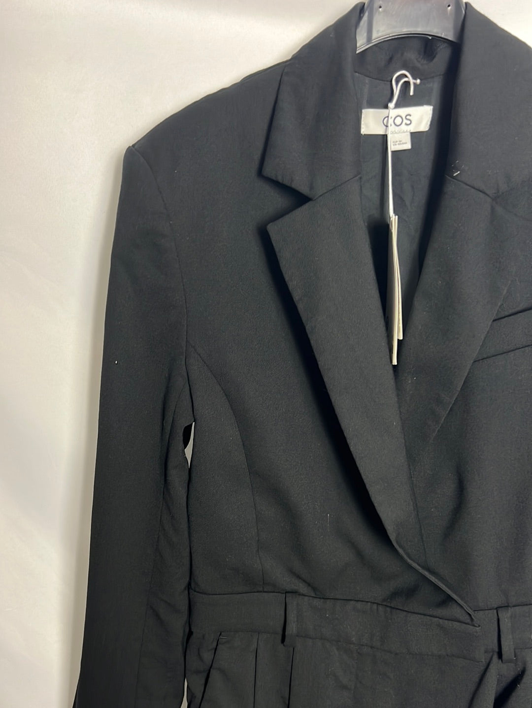 COS. Black jumpsuit with shoulder pads. Size 36