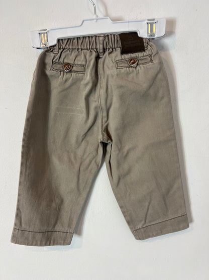 BONNET Á POMPON. Pantalón beige botones. T 12 meses