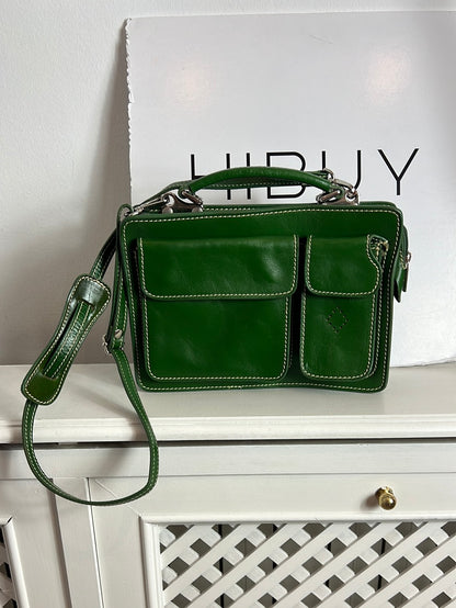 OTRAS. Bolso piel verde bolsillos