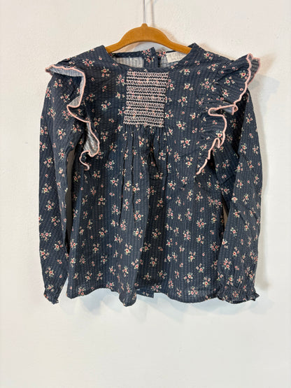 MI CANESÚ.  Camisa azul flores volantes. T 36 meses